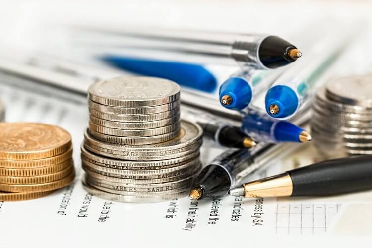 coins-currency750x500 coin stack with pens