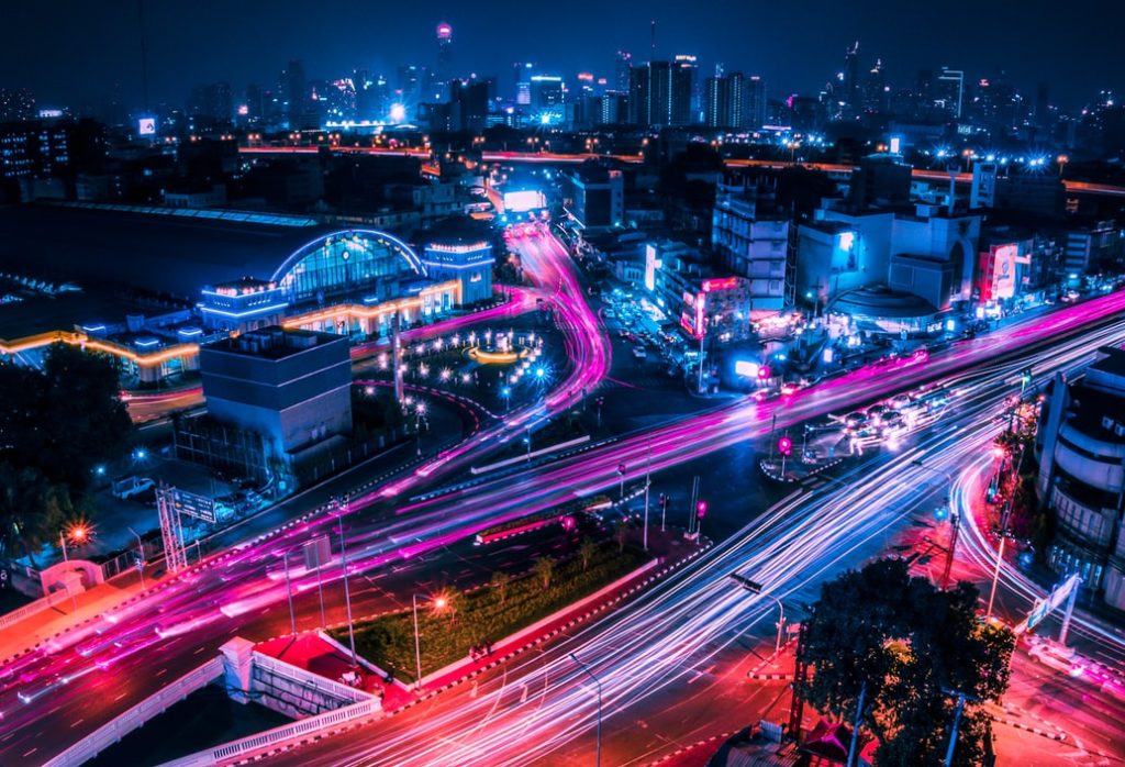 Cars rushing down busy freeways at night