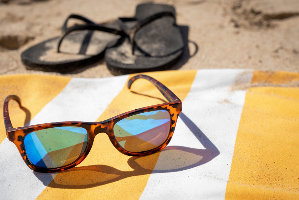 Sunglasses on a beach towel
