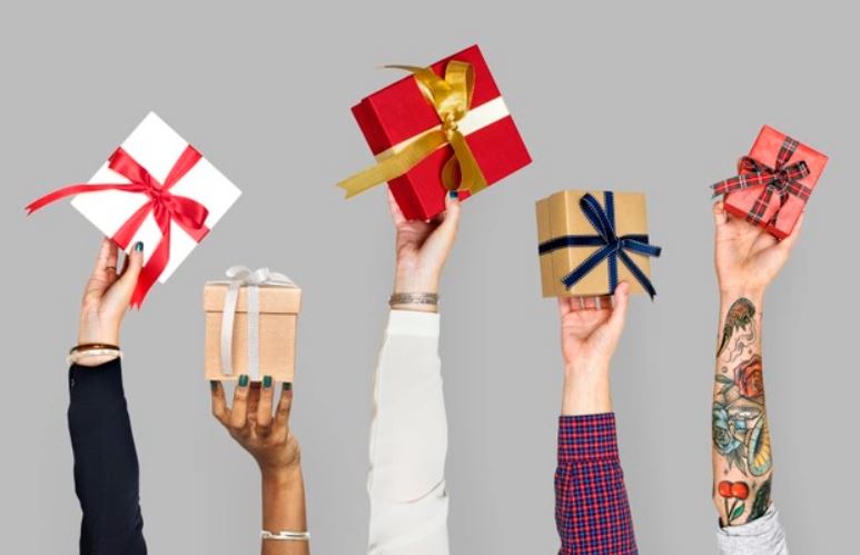 Hands holding personalized corporate gift wrapped