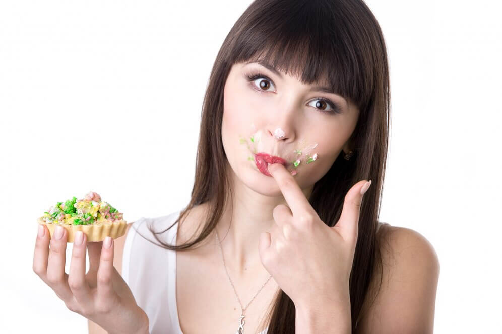 Woman licking her fingers eating a promotional food giveaway